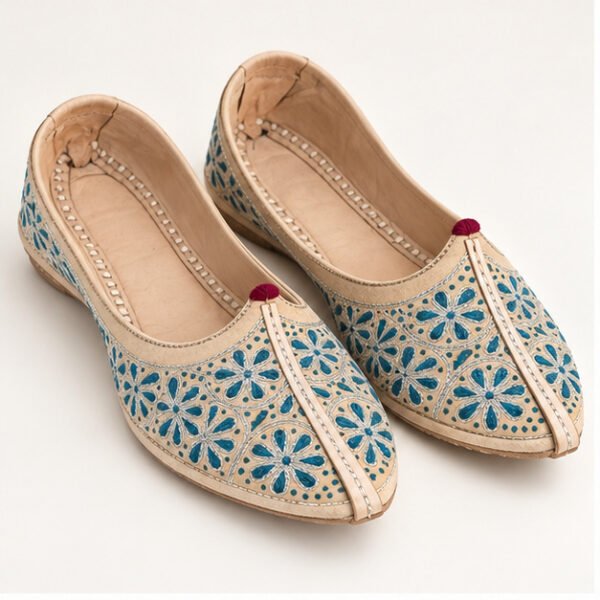 MyMarwar beige jutti with teal floral embroidery for men, front view of pair
