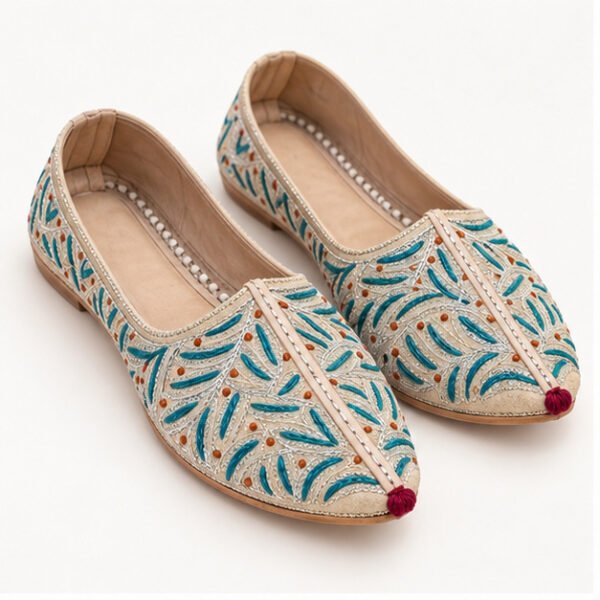 MyMarwar beige mojari with teal and orange leaf embroidery for men, front view of pair