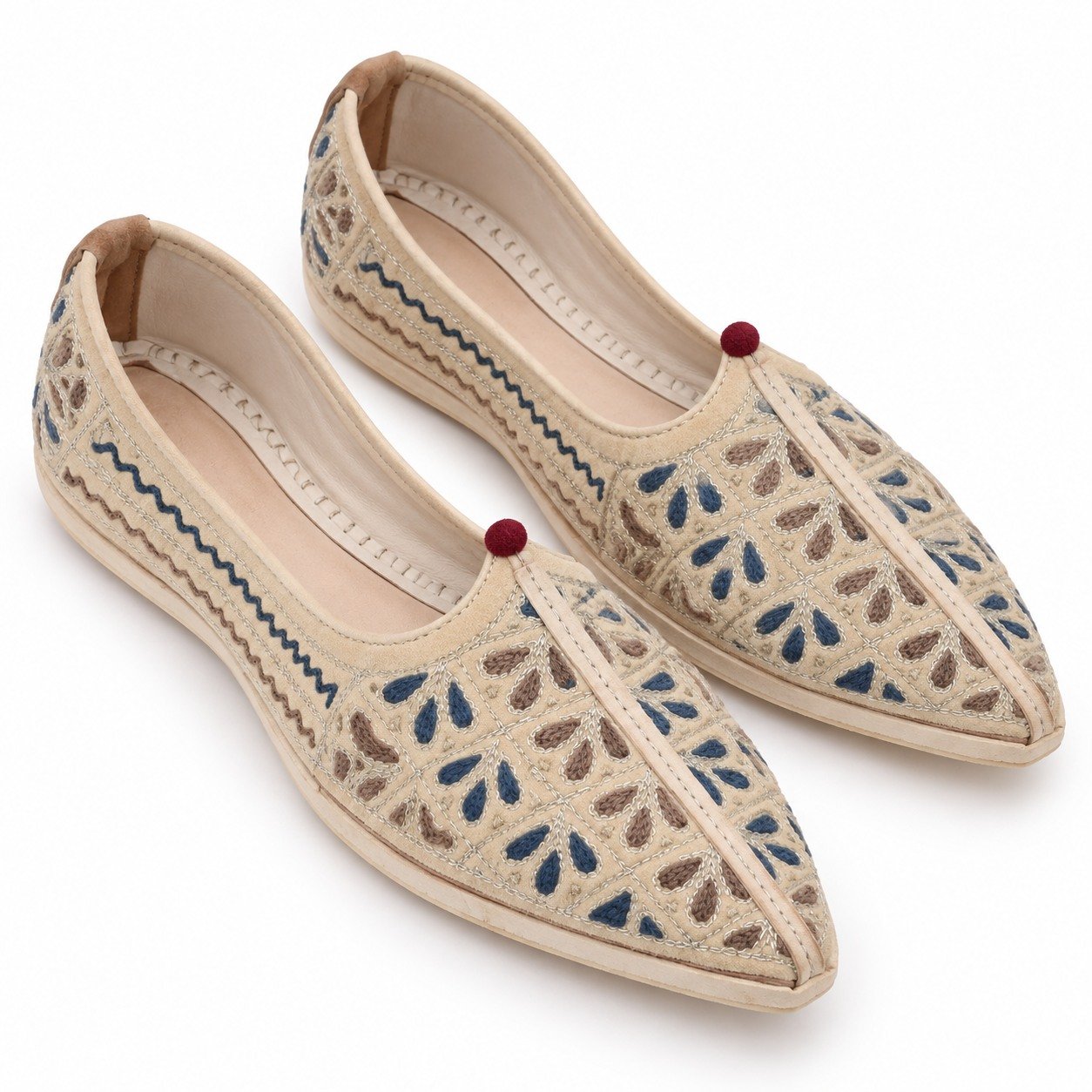 MyMarwar beige, blue and brown mojari for men with small floral leaf embroidery, angled view of embroidery and shape