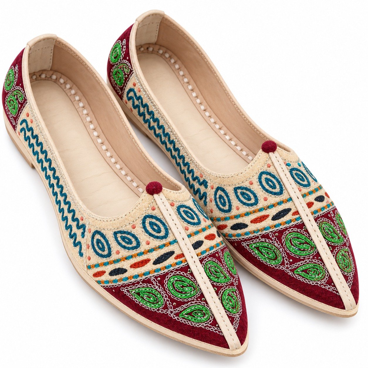 MyMarwar beige, burgundy, green and teal mojari for men with paisley and spiral embroidery, angled view of embroidery and shape
