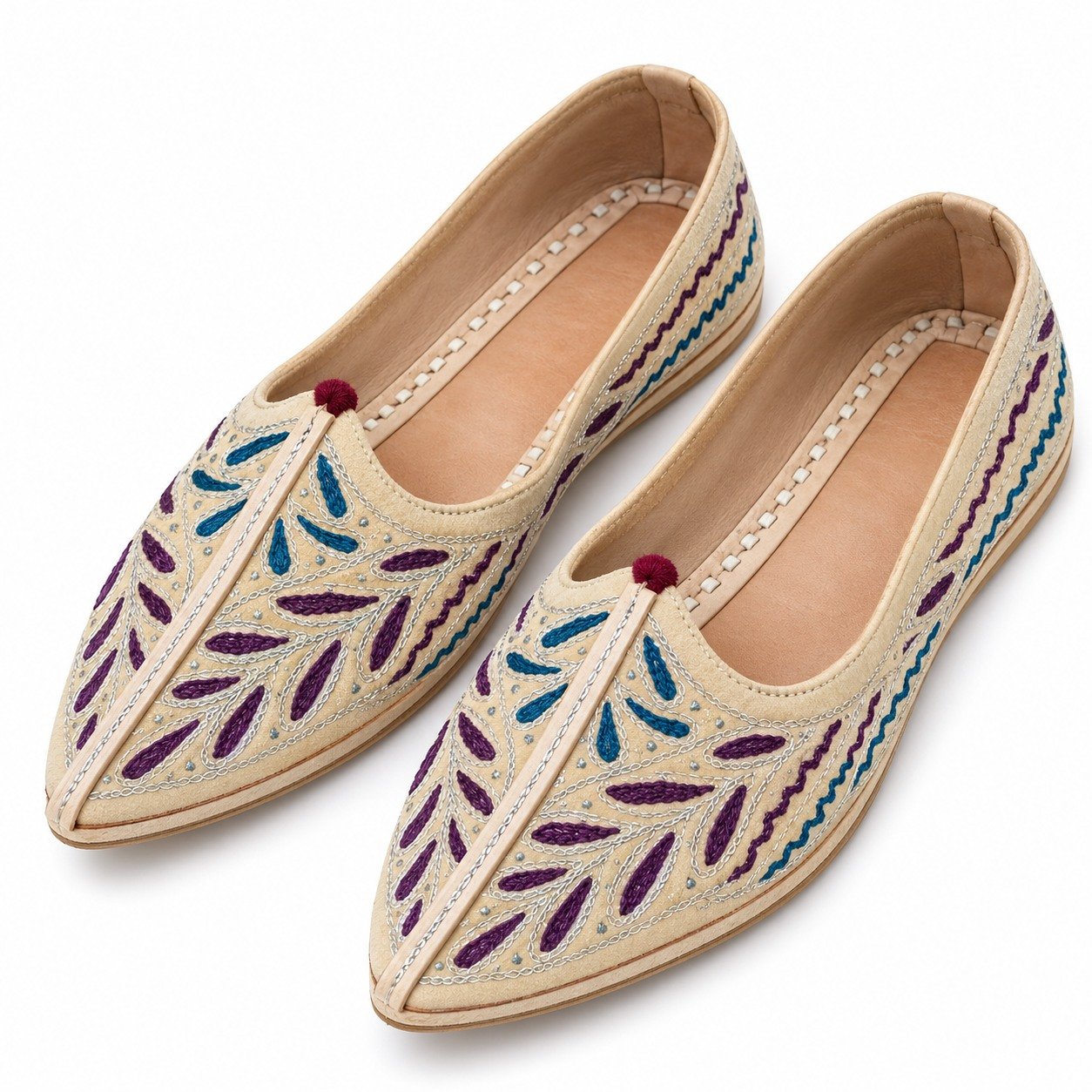 MyMarwar beige, plum and teal mojari for men with elongated leaf embroidery, angled view of embroidery and shape